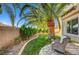 Inviting backyard with a comfortable chair and a well-manicured garden, creating a peaceful retreat at 1353 Volturno Way, Henderson, NV 89052