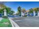 Grand gated community entrance with elegant pillars and lush landscaping at 1353 Volturno Way, Henderson, NV 89052