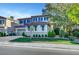 Charming two-story home with a well-manicured lawn and lush landscaping, creating a welcoming curb appeal at 1353 Volturno Way, Henderson, NV 89052