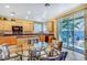 Bright eat-in kitchen featuring granite countertops, light wood cabinets and stainless steel appliances at 1353 Volturno Way, Henderson, NV 89052
