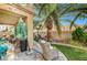 Cozy patio offers comfortable seating, lush palm trees and manicured lawn at 1353 Volturno Way, Henderson, NV 89052