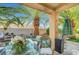 Covered patio boasting outdoor seating, desert landscaping, and shade for relaxation at 1353 Volturno Way, Henderson, NV 89052