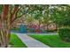 Fun community playground with climbing features and a slide, set in a beautifully landscaped park at 1353 Volturno Way, Henderson, NV 89052