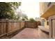 Fenced backyard with brick-paver patio and outdoor bar area provides space for outdoor dining at 1467 Hialeah Dr # C, Las Vegas, NV 89119