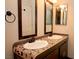Well-lit bathroom with double sinks and decorative mirrors offer functionality and a touch of elegance at 1467 Hialeah Dr # C, Las Vegas, NV 89119
