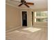 Bright bedroom with large window, ceiling fan, and neutral walls offers a peaceful retreat at 1467 Hialeah Dr # C, Las Vegas, NV 89119