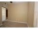 Carpeted bedroom featuring window with blinds and a ceiling fan at 1467 Hialeah Dr # C, Las Vegas, NV 89119