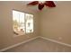 Neutral bedroom featuring a window providing natural light and view to the neighborhood at 1467 Hialeah Dr # C, Las Vegas, NV 89119