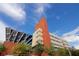 Modern building with architectural detail and solar panels against a bright sky at 1467 Hialeah Dr # C, Las Vegas, NV 89119