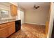 Dining area featuring tiled floors, natural wood cabinets and a ceiling fan at 1467 Hialeah Dr # C, Las Vegas, NV 89119