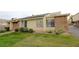 Simple exterior view of a home with lawn at 1467 Hialeah Dr # C, Las Vegas, NV 89119