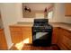 A charming kitchen featuring a black gas range stove and sleek countertops at 1467 Hialeah Dr # C, Las Vegas, NV 89119