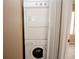 Efficient laundry area features a stacked washer and dryer set, maximizing space and convenience at 1467 Hialeah Dr # C, Las Vegas, NV 89119