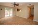 Bright living room with brick flooring and sliding glass doors to the backyard at 1467 Hialeah Dr # C, Las Vegas, NV 89119