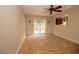 Bright living room with unique tile flooring, ceiling fan, and sliding glass door at 1467 Hialeah Dr # C, Las Vegas, NV 89119