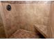Stylish shower featuring decorative tile and shower seat, offering a spa-like experience at home at 1467 Hialeah Dr # C, Las Vegas, NV 89119