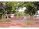 Scenic street view with a sidewalk winding through lush trees and greenery at 1467 Hialeah Dr # C, Las Vegas, NV 89119