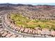 Aerial view of a golf course community, highlighting well-maintained homes surrounding a lush green golf course at 1781 Cypress Lake Ct, Henderson, NV 89012