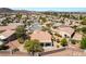 Expansive community view featuring desert landscaping, stucco homes and terra cotta tile roofs at 1781 Cypress Lake Ct, Henderson, NV 89012