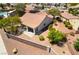 An aerial view shows a home with desert landscaping, a terra cotta tile roof, and an enclosed patio at 1781 Cypress Lake Ct, Henderson, NV 89012