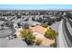 An overhead view of a neighborhood featuring stucco homes, terra cotta tile roofs and desert landscaping at 1781 Cypress Lake Ct, Henderson, NV 89012