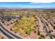 Expansive aerial view showcases a lush golf course community with well-manicured greens, water features and surrounding homes at 1781 Cypress Lake Ct, Henderson, NV 89012