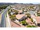 A beautiful home with a terra cotta tile roof and desert landscaping in a Primary-planned community at 1781 Cypress Lake Ct, Henderson, NV 89012
