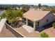 An aerial view shows a home with desert landscaping, a terra cotta tile roof, and an enclosed patio at 1781 Cypress Lake Ct, Henderson, NV 89012