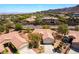 Aerial view of desert community showcasing lush landscaping, mature trees and well-maintained homes at 1781 Cypress Lake Ct, Henderson, NV 89012