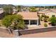 A view of a home with desert landscaping, a terra cotta tile roof, and an enclosed patio at 1781 Cypress Lake Ct, Henderson, NV 89012