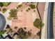 An overhead shot of a home featuring desert landscaping, a terra cotta tile roof, and an enclosed patio at 1781 Cypress Lake Ct, Henderson, NV 89012
