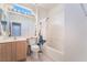Bathroom with a single vanity, a toilet, and a shower-tub combination with a shower curtain at 1781 Cypress Lake Ct, Henderson, NV 89012