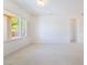 Bright living room with carpet, plantation shutters, and ample natural light at 1781 Cypress Lake Ct, Henderson, NV 89012