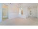 Bright and airy living room with carpet, chandelier, and an open floor plan at 1781 Cypress Lake Ct, Henderson, NV 89012