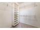 Walk-in closet includes shelving and metal hanging racks for storage at 1781 Cypress Lake Ct, Henderson, NV 89012