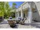 Covered patio with outdoor seating around a fire pit, offering comfortable entertainment space at 2008 Winter Wind St, Las Vegas, NV 89134