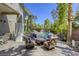 Cozy backyard seating area with firepit by the pool and spa, offering a relaxing retreat at 2008 Winter Wind St, Las Vegas, NV 89134