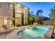 Inviting backyard featuring a sparkling pool, spa, lounge chairs, and a beautiful home exterior at 2008 Winter Wind St, Las Vegas, NV 89134