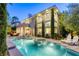 Inviting backyard featuring a sparkling pool, spa, lounge chairs, and a beautiful home exterior at 2008 Winter Wind St, Las Vegas, NV 89134