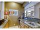 Conveniently-placed bar area with sink and mini fridge; perfect for entertaining at 2008 Winter Wind St, Las Vegas, NV 89134