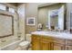 Bathroom featuring tub, tiled shower, wood cabinets and sink at 2008 Winter Wind St, Las Vegas, NV 89134
