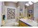 Full bathroom with colorful tiled shower/tub combo, and a modern sink at 2008 Winter Wind St, Las Vegas, NV 89134