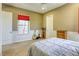 Bedroom features a window, guitar, and ceiling fan at 2008 Winter Wind St, Las Vegas, NV 89134