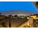 Expansive city and mountain views at night from a backyard at 2008 Winter Wind St, Las Vegas, NV 89134