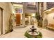 Picturesque courtyard with a charming water fountain, stone accents, and space for outdoor seating at 2008 Winter Wind St, Las Vegas, NV 89134