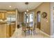 Charming dining area with glass table and seating for four, conveniently located off the kitchen at 2008 Winter Wind St, Las Vegas, NV 89134