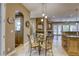 Charming dining area with glass table and seating for four, conveniently located off the kitchen at 2008 Winter Wind St, Las Vegas, NV 89134