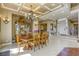 Dining room with coffered ceilings, large chandelier, and view into the foyer at 2008 Winter Wind St, Las Vegas, NV 89134