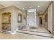 Elegant foyer with tile flooring, recessed lighting and a grand front entrance door with transom windows at 2008 Winter Wind St, Las Vegas, NV 89134
