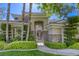 Charming home with stone accents, manicured landscaping and decorative trees surrounding the entrance at 2008 Winter Wind St, Las Vegas, NV 89134